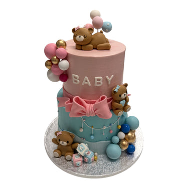 Custom pink and blue baby shower cake with teddy bears and alphabet blocks