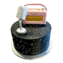 Custom Cake featuring matte black buttercream, tiny white sugar pearls, a vintage-style microphone, and retro radio fondant decorations atop a silver cake board.