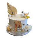Custom Cake featuring a Winnie-the-Pooh hunny theme with edible decorations, pastel cream spheres, daisies, and bee toppers, ideal for celebrations. Contact for order details.