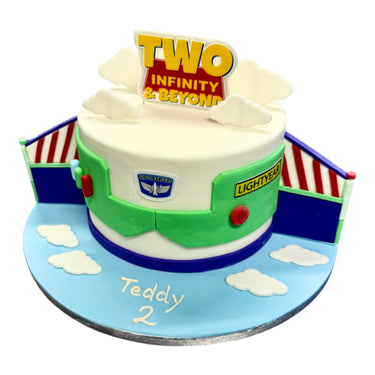 Custom Cake styled as Buzz Lightyear for a child's second birthday, featuring fondant details and a TWO Infinity & Beyond topper. Contact us before purchase.