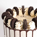 Vegan Free From Oreo Cake with chocolate drip, vanilla buttercream swirls and Oreo pieces