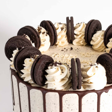 Vegan Free From Oreo Cake with chocolate drip, vanilla buttercream swirls and Oreo pieces
