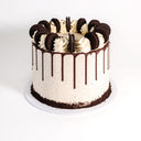 8 inch Oreo Cake with speckled cookie buttercream, chocolate drip and Oreo biscuits