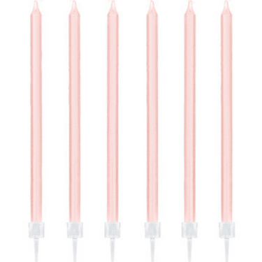 Six blush pink taper cake candles with white holders