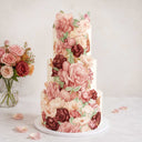Floral Cutout Wedding Cake with sugar flowers on dark tiers