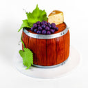 Wooden barrel style Wine Barrel Cake with fondant grapes, leaves and cheese