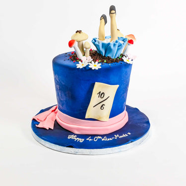 Alice in Wonderland Cake shaped like a hat, with sugar mushrooms and Alice themed decorations