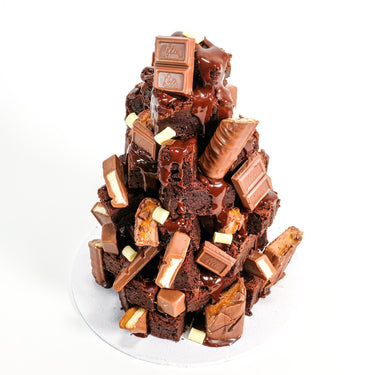 Brownie Tower with chocolate drizzle, milk and white chocolate chunks and caramel chocolate bar pieces