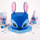 Free From Stitch Cake, a two tier blue fondant cake shaped as Stitch, with party supplies