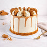 Vegan Free From Biscoff Cake with off white buttercream, caramel drip, rosettes and Biscoff biscuits
