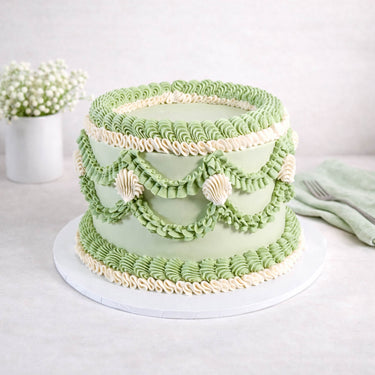 Frilly Round Cake with sage green buttercream, piped swags and ruffles