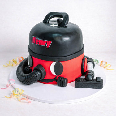 Henry Hoover Cake made to look like the red and black vacuum cleaner