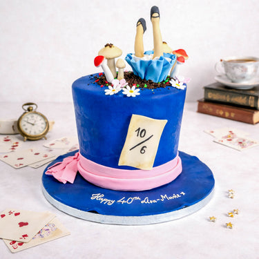 Alice in Wonderland Cake shaped as the Mad Hatter's hat, with fondant legs, mushrooms, daisies and cards