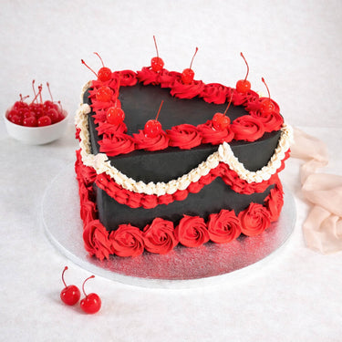 Halloween Heart Cake with charcoal buttercream, red rosettes and cherries