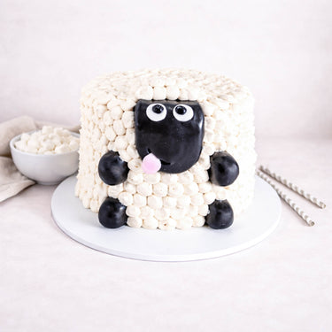 Fluffy Sheep Cake with piped buttercream wool and a fondant sheep face, with mini marshmallows