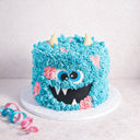 Free From gluten friendly Monster Cake with blue buttercream fur, fondant eyes and teeth and yellow horns