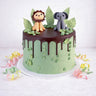Free From Jungle Cake with pale green buttercream, chocolate drip and a fondant lion and elephant