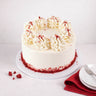 Mini Red Velvet Cake with piped buttercream swirls and red velvet crumbs