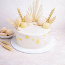 Mini Dried Grasses Cake with off white buttercream, gold leaf, macarons, truffles, dried wheat and pampas