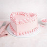 Mini Heart Cake with pale pink buttercream, piped rosettes and ruffles, with pink confetti