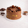 Mini Triple Chocolate Cake with chocolate buttercream, truffles and biscuit pieces, next to chocolate chunks