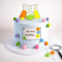 Free From Science Cake with fondant lab flasks, molecules and periodic table tiles