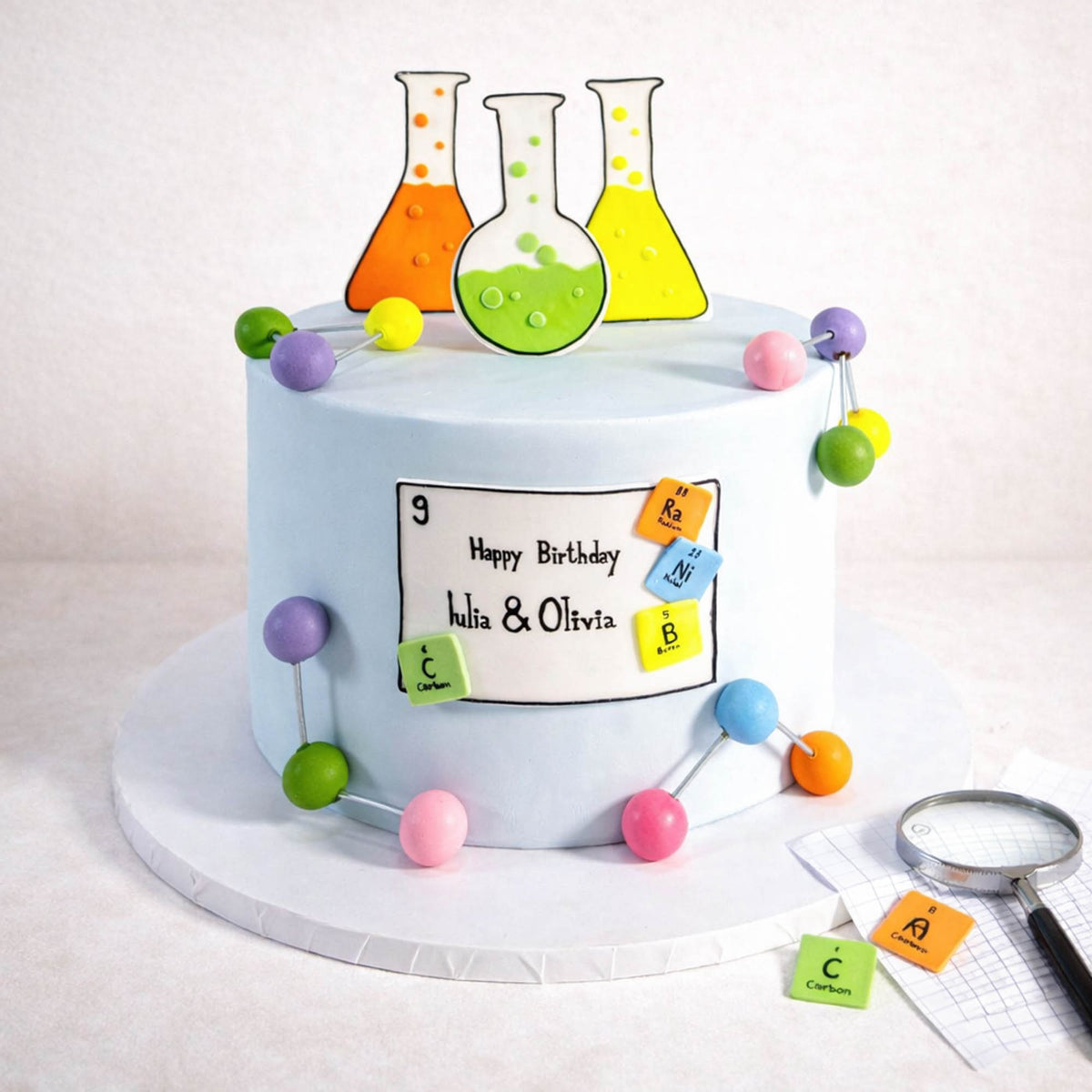 Free From Science Cake with fondant lab flasks, molecules and periodic table tiles