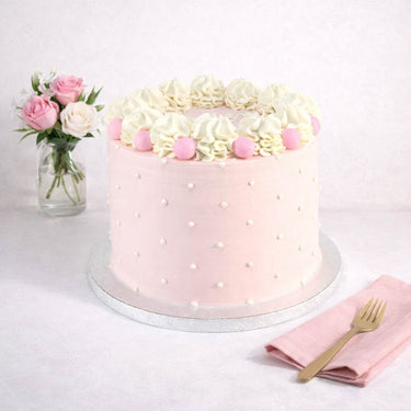 6 inch Polka Dot Cake with pale pink buttercream, white piped swirls and pink sugar balls