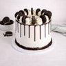 Oreo Cake with cookies and cream buttercream, chocolate drip, vanilla swirls and Oreo biscuits on top