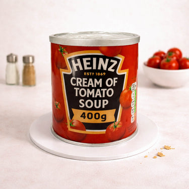 Soup Can Cake made to look like a tin of cream of tomato soup, with cherry tomatoes
