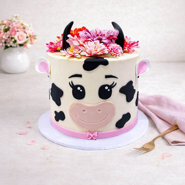 Cow Cake with a cow face, fondant details and silk flowers