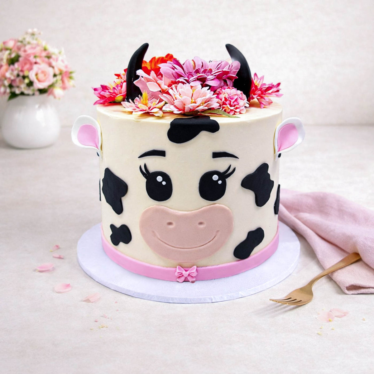Cow Cake with a cow face, fondant details and silk flowers
