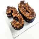 Chocolate Number Cake shaped as 30, with piped chocolate cream, chocolate treats and gold sprinkles