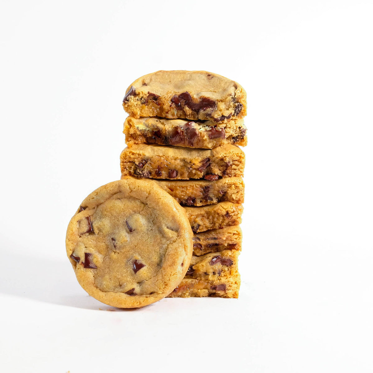 Stack of chocolate chip cookies, one with a bite taken out