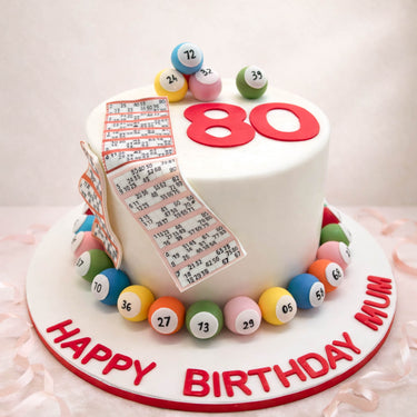 80th birthday bingo cake with bingo balls and a bingo card