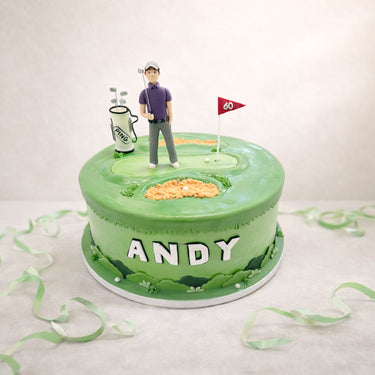 Golf course birthday cake with a golfer figure and a flag
