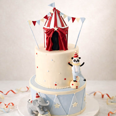 Two tier circus cake with a big top, a panda and an elephant