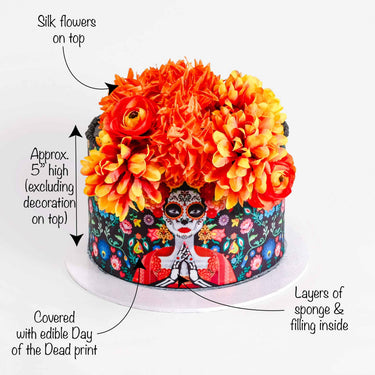 Day of the Dead Cake with a sugar skull lady design and silk flowers on top