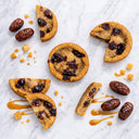 Sticky Toffee Cookies with Medjool dates and caramel sauce on marble