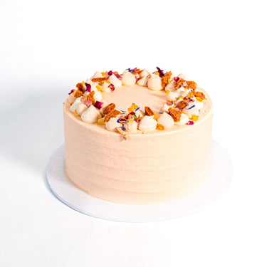 Mini Carrot Cake topped with buttercream, honeycomb pieces and edible flower petals