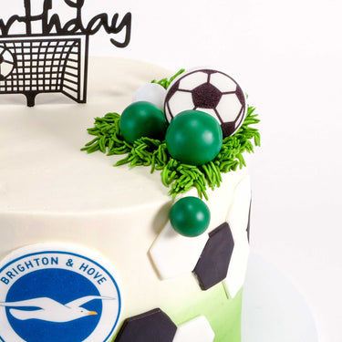 Free From Football Cake with football panels, a club crest, green grass and a cake topper