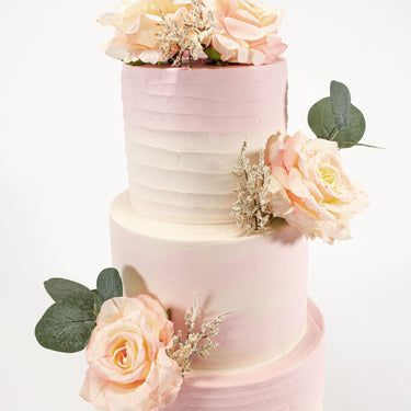 Three tier Ombré Wedding Cake in ivory to blush pink, with peach roses and eucalyptus
