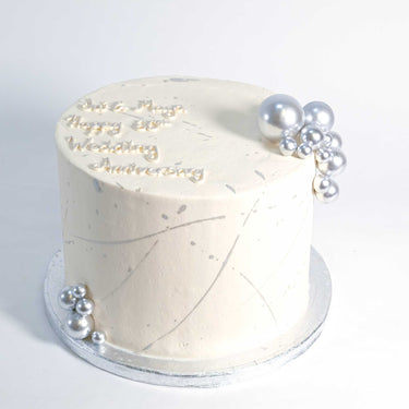 Silver Cake with off white icing, silver pearls and splatter, made for a 60th wedding anniversary