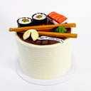 Sushi Cake with fondant sushi, chopsticks and a 10th birthday banner on smooth buttercream