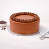 Chocolate Cake with piped buttercream and chocolate chips on a silver board