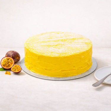 White Chocolate and Passion Fruit Cake next to fresh passion fruit
