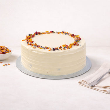 Victoria Sponge with smooth white buttercream and edible petals