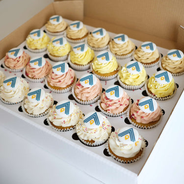 Box of 6 branded cupcakes with pastel buttercream, sugar pearls and a printed company logo on each