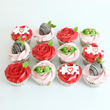 12 Valentines Cupcakes with rose swirls, chocolate strawberries and fondant puzzle pieces and peas in a pod
